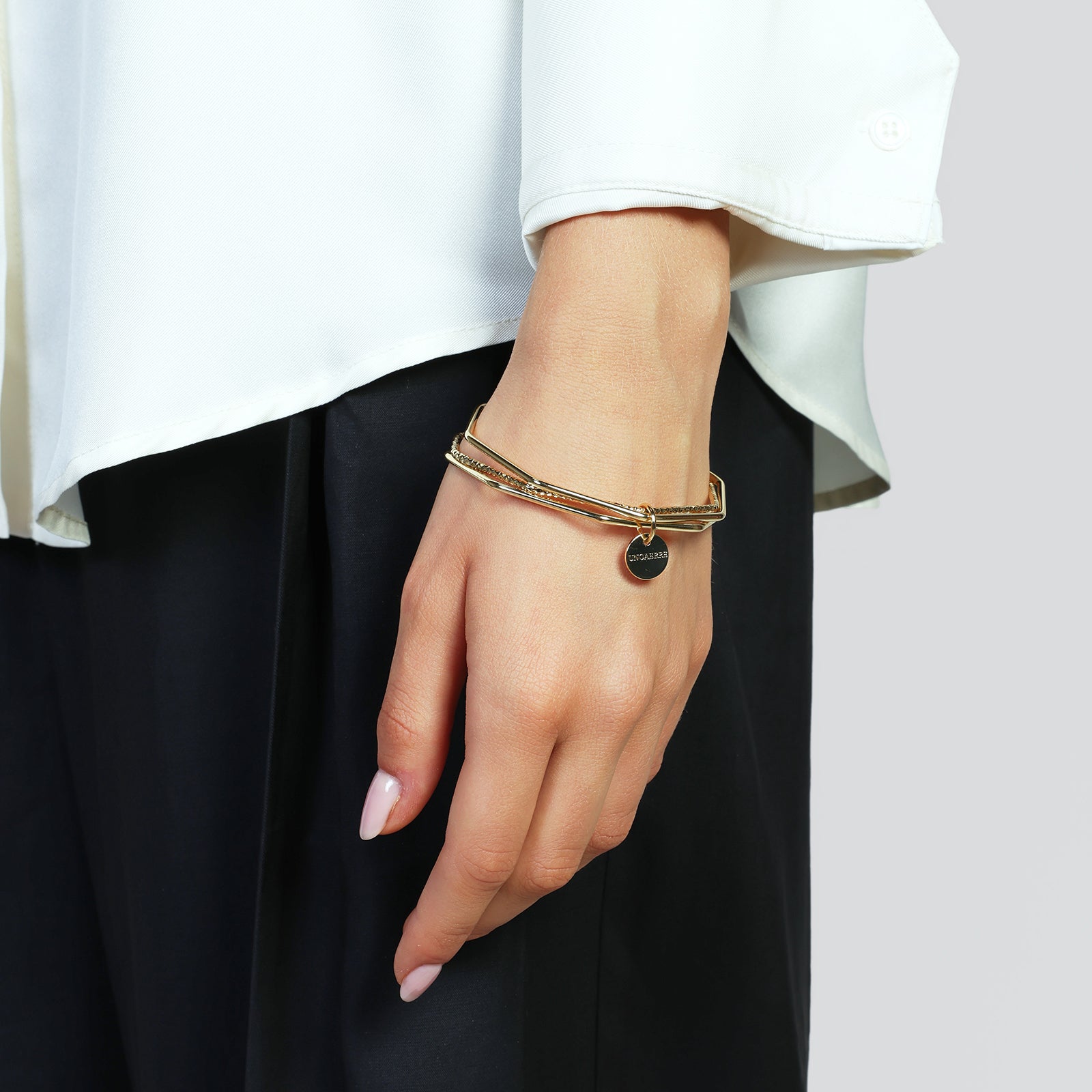 Bracciale dorato Unoaerre da donna 3 bangle